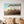 Load image into Gallery viewer, Ethereal series #09 artwork featuring a teal sky, sunset, and golden tree tips on gallery-wrapped canvas in a cozy living room setting