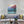 Load image into Gallery viewer, "Cabin and Reds Lakeside in the Mountains" print by Thomas Andrew - ThomasAndrewArtwork